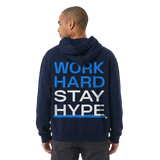 Person wearing a navy hoodie with 'WORK HARD STAY HYPE' text on the back.